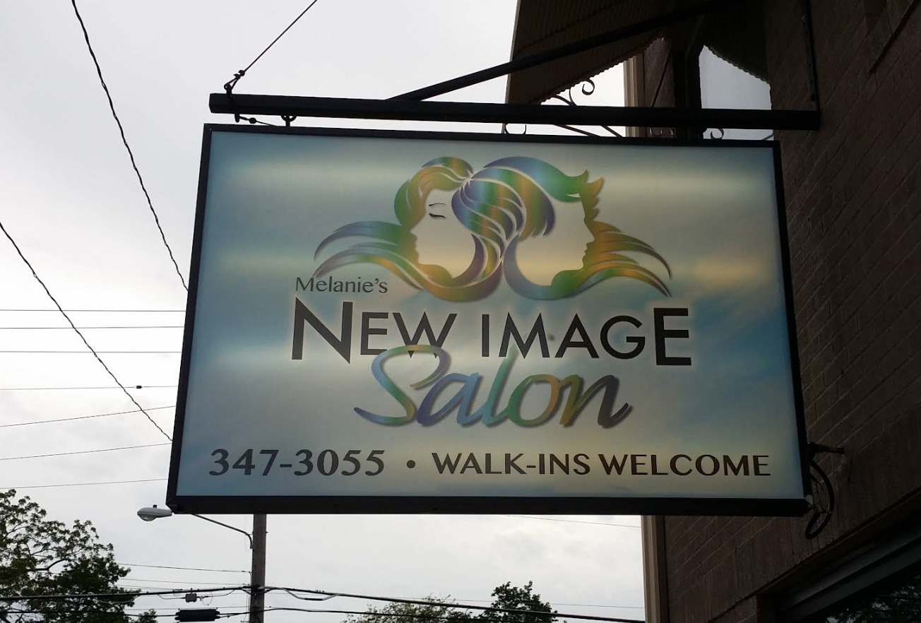 Melanie's New Image Salon storefront sign